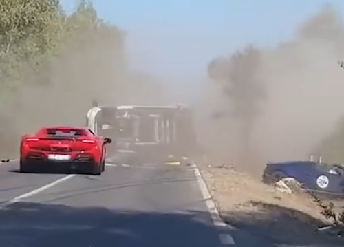 Ferrari supercar bursts into flames after crashing into Lamborghini, killing two people.